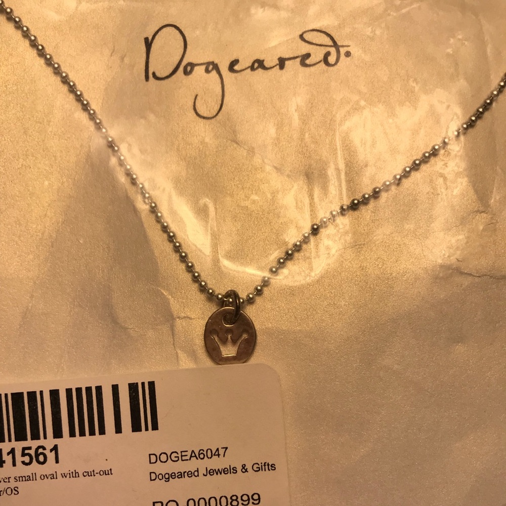 Dogeared silver necklace with crown cutout